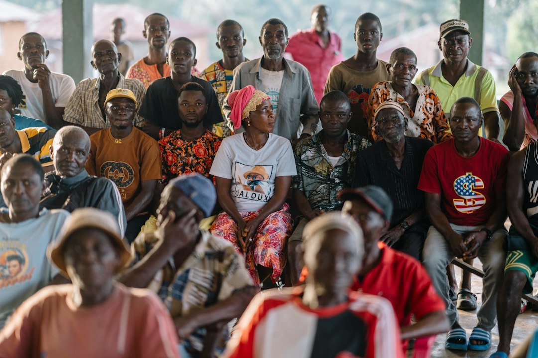 Illustrative photo of a community group meeting for emergency preparedness; not the official ActionAid circular