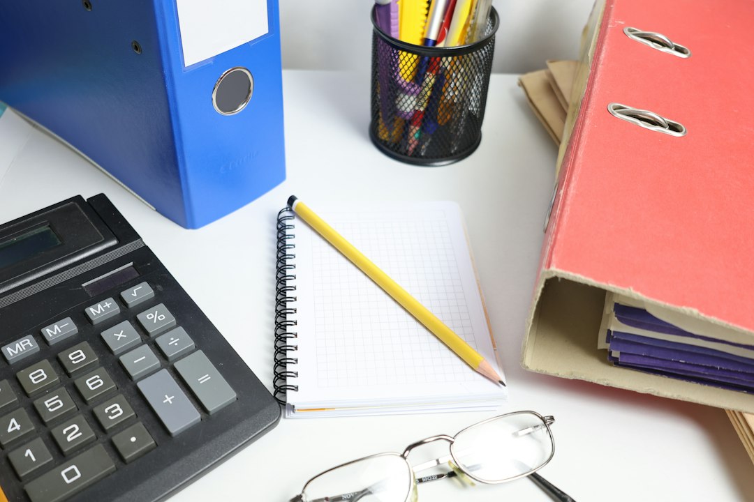 Illustrative office documents and calculator for Taxes Zone-6 Dhaka recruitment notice